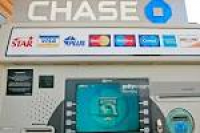 A Chase ATM stands outside a JPMorgan Chase & Co. bank branc ...