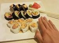 Michigan roll on top and spicy tuna roll. My hand for reference ...