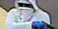Masked man wields gun in East Side bank robbery