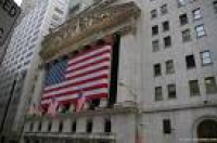 New York Stock Exchange Building with huge American Flag at Wall ...