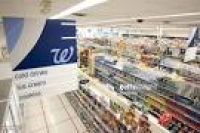 Items sit on shelves inside a Walgreens store in Wayne, New ...